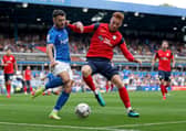 Scott Hogan (left) battles with North End’s Sepp van den Berg