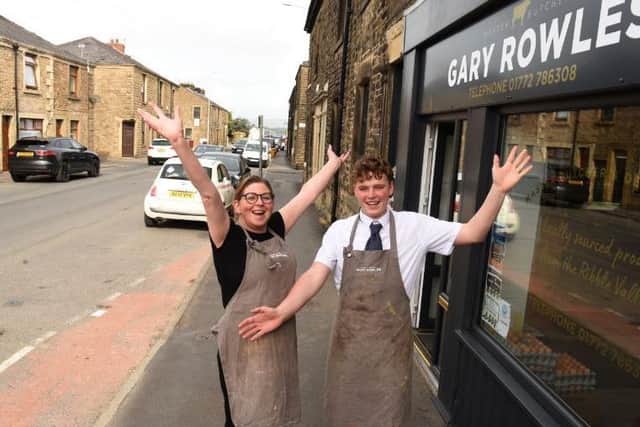 Joanne Bailey and Ben Smith of Gary Rowles Butchers celebrate the completion of road works