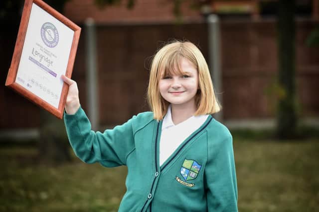 Matilda Blunden,10, pictured with the award which she presented to Longridge's mayor.