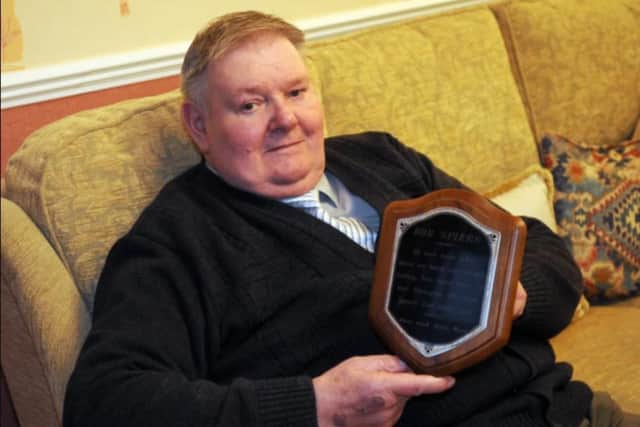 Bob Spiers with a plaque given to him by Lesley Ann Downey's family as a 'thank you' for finding her body on the moors.