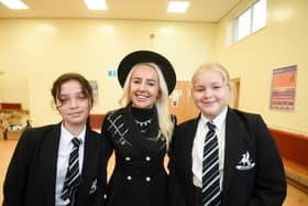 Freestyle world champion and TikTok star Liv Cooke pays a visit to her old school Balshaw's Church of England High to celebrate her first book release. She is pictured with pupils Ava Millard and Millie Banks, both aged 12.