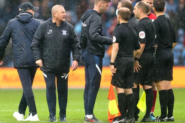 PNE head coach Frankie McAvoy and coach Paul Gallagher speak with the officials at the final whistle at QPR