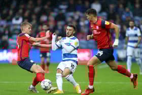 Ali McCann and Jordan Storey challenge QPR's  Ilias Chair