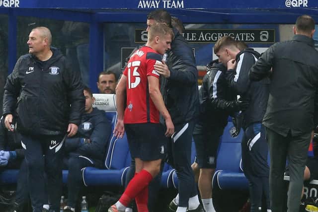 PNE midfielder Ali McCann is substituted at QPR after sustaining an ankle injury