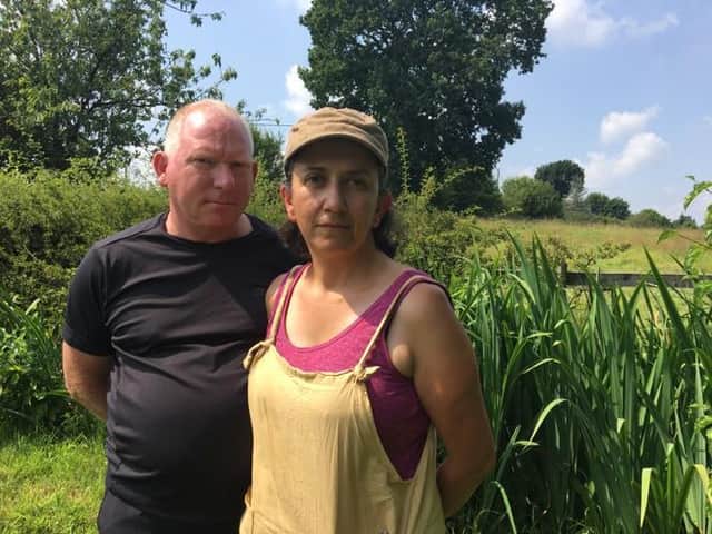 Mark Hanscomb and Dr Sheila Cromie, who are objecting to the proposals, pictured in front of the field where the development will take place.