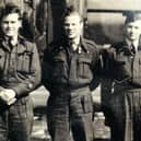 Gordon Stobbart (centre) with crew mates.