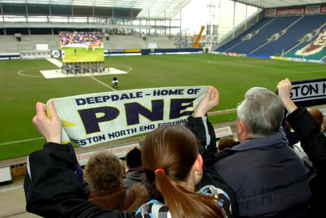 Preston North End fans at Deepdale watch the beam back of the clash with Blackpool in 2008
