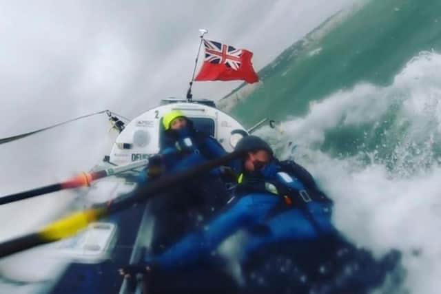 Marines Matt Mason and Jordan Swift almost capsizing near Dover after rowing across the Atlantic