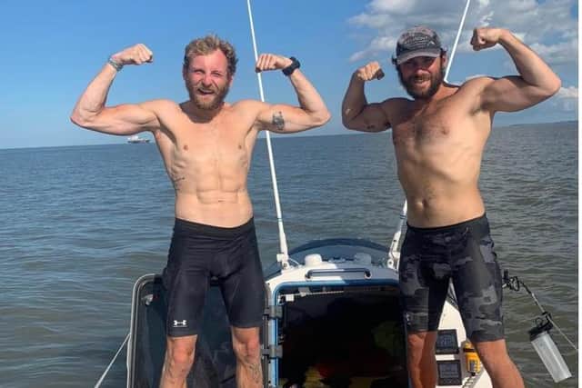 Marines Matt Mason and Jordan Swift show off their weight loss during their row across the Atlantic