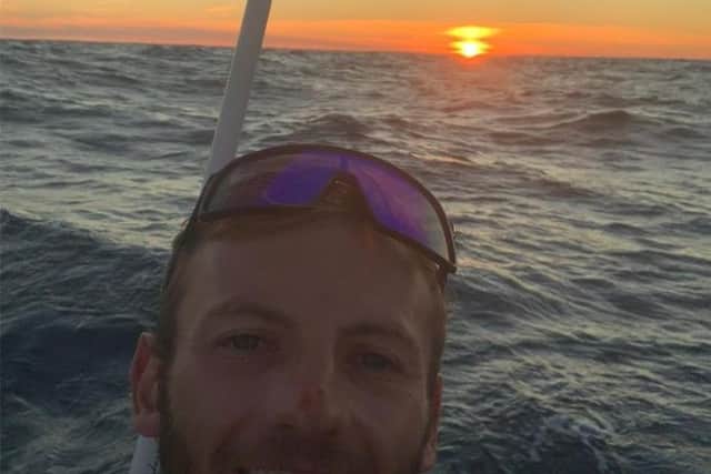 Jordan Swift enjoys an Atlantic sunset during his row across the ocean