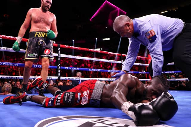 Tyson Fury (top) knocks out Deontay Wilder in the 11th round (photo: Getty Images)