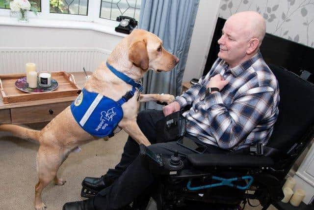 Former soldier John now relies on a wheelchair and the support of support dog Casper
