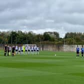 Preston North End and Rochdale players observe a minute's silence at Euxton     Pic by Tom Sandells