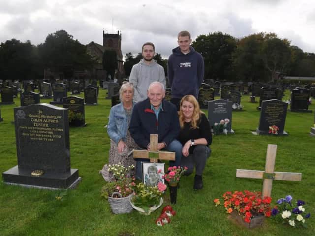 Brenda's husband Jack at the graveside with daughters Jane Harrison and Joanne Brooks and grandsons Jack and Alex.