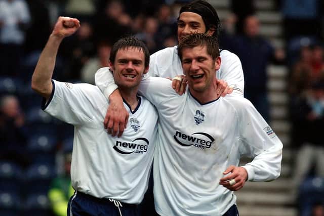 Graham Alexander (left) celebrates with his team-mates after scoring Preston’s first against Derby County at Deepdale