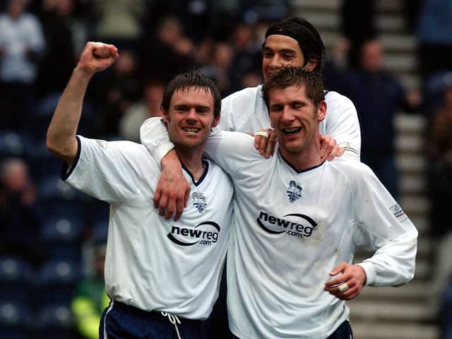 Graham Alexander (left) celebrates with his team-mates after scoring Preston’s first against Derby County at Deepdale