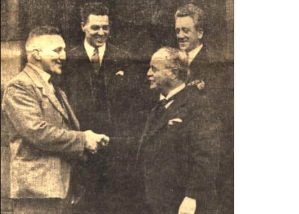 Boxer Tommy Tucker (left) shaking hands with former LEP sportswriter JA Brierley, alias Perseus.