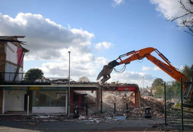 The former shops and maisonettes are now being demolished to make way for Phase 2 of the development