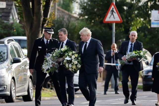 Labour Party Leader Keir Starmer, Prime Minister Boris Johnson, Speaker of the House of Commons Sir Lindsay Hoyle and Home Secretary Priti Patel arrive to lay flowers outside the Belfair Methodist Church following the stabbing of UK Conservative MP Sir David Amess