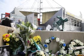Floral tributes on the Splash statue outside Deepdale to Preston North End owner Trevor Hemmings