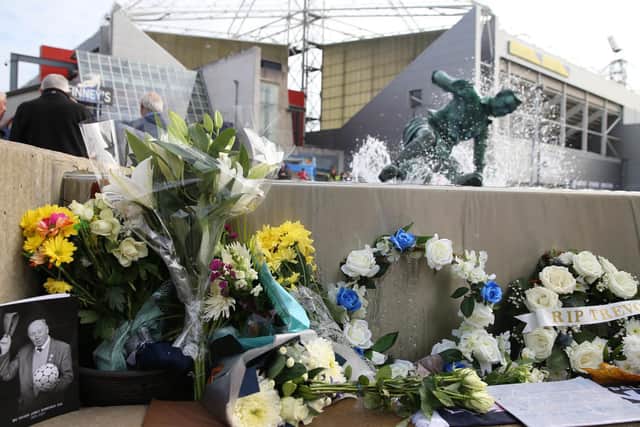 Floral tributes on the Splash statue outside Deepdale to Preston North End owner Trevor Hemmings