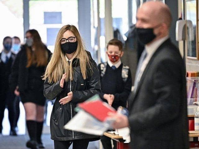 Staff and students at Preston College are being asked to wear face masks again.