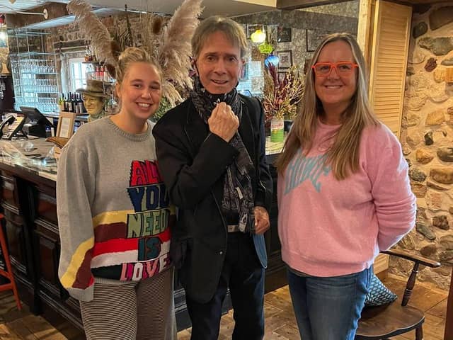 The Cartford Inn shared a picture of Sir Cliff and two staff members on its Facebook page, with the business saying, "Sir Cliff loved the Inn". Pic: The Cartford Inn