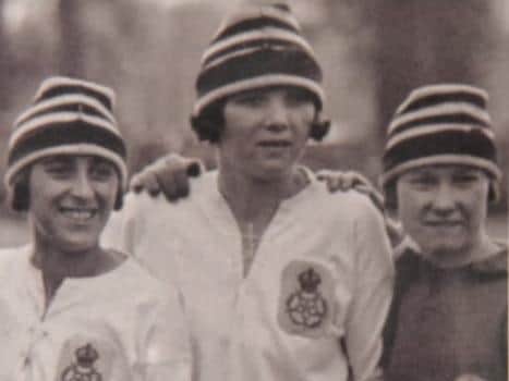 Women's football star Lizzy Ashcroft (centre) in her days with Dick, Kerr Ladies.