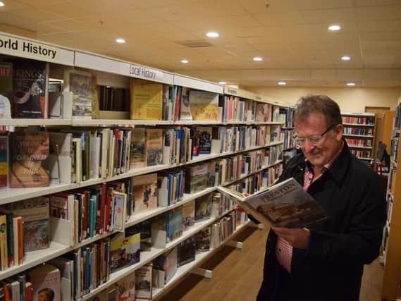 Coun Peter Kelly in the new pop up library that opened on Monday