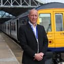 Northern Regional Director Chris Jackson stand with one of Northern's bi-mode 769 trains