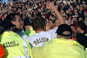 Neil Mellor goes into the crowd to celebrate his goal