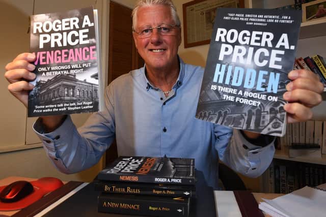 Proud author Roger pictured with his previous books