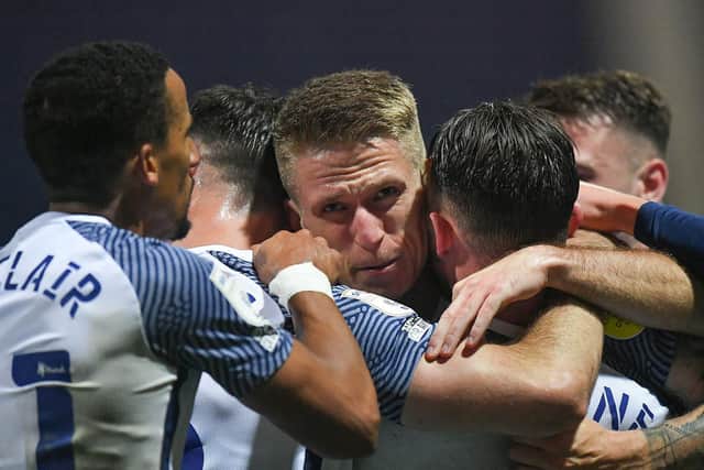 Emil Riis is mobbed by his PNE team-mates after scoring against Coventry