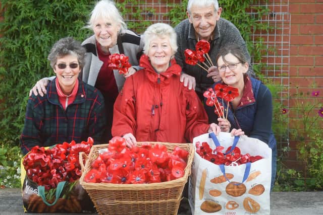 Leyland in Bloom are making poppies from plastic bottles. Pictured are Margaret Oliver, Valerie Watson, Jane Bennett, Alan Iddon and Debbie Noblett.