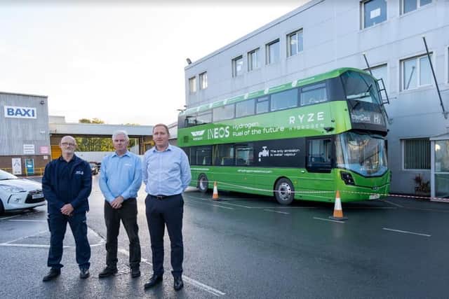 The hydrogen bus with David Carr, John Regan-Stansfield and James Newell, who all work in the Baxi R&D department, developing the company's new 100 per cent hydrogen boiler.