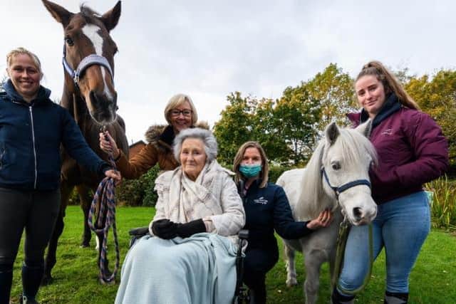 (l-r) Jennifer Brookfield, Janette Heaps (daughter), Shirley Almond, Emma Powers (Activities Coordinator), Jessica Duckett with the horses at Sherwood Court Care Home. Photo: Kelvin Stuttard