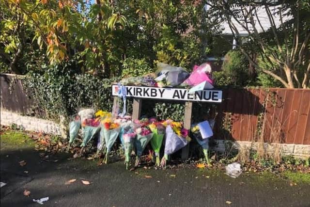 Floral tributes have been left on the corner of Kirkby Avenue in memory of Carl Whalley.