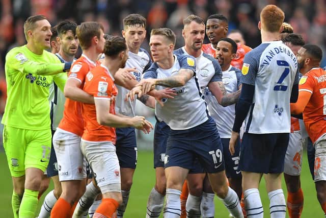 Preston North End and Blackpool players come together during stoppage-time