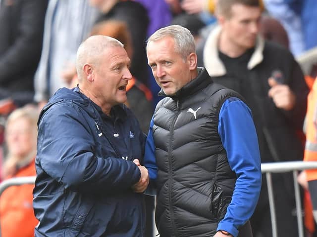 Preston North End head coach Frankie McAvoy with Blackpool boss Neil Critchley