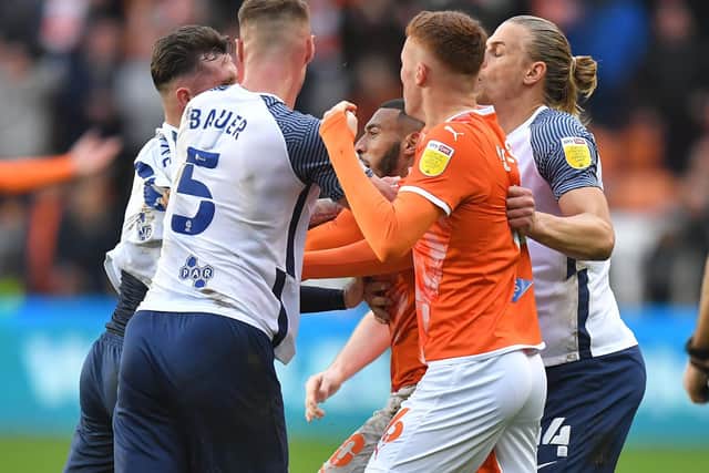 PNE skipper Alan Browne (left, partly hidden) gets involved in a melee which led to a red card at Blackpool