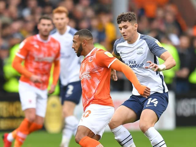 Preston North End defender Jordan Storey challenges Blackpool's Keshi Anderson