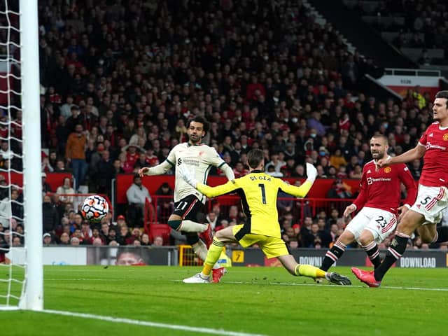Liverpool’s Mohamed Salah (left) scores their side’s fifth goal at Old Trafford