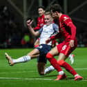 Ali McCann battles with Liverpool’s Harvey Blair at Deepdale on Wednesday night