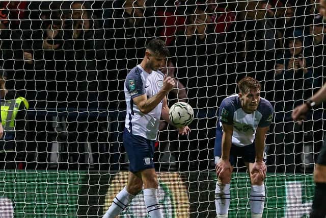 Andrew Hughes picks the ball out of the net after Preston North End concede the second goal against Liverpool at Deepdale