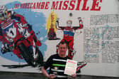 John McGuinness with the Sunshine Ambassador Award and the new mural in Morecambe paying tribute to his motorcycling achievements.