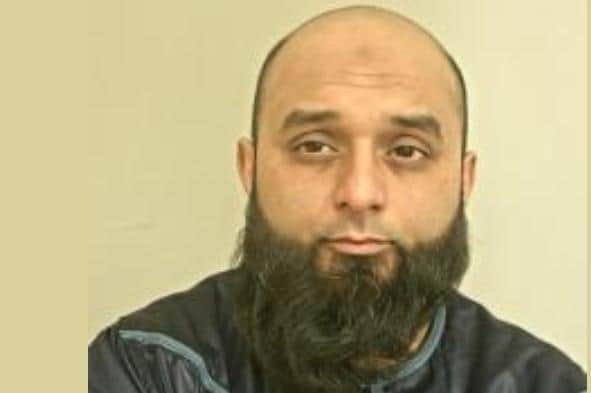 Zubair Ahmed Ali , 37, is wanted on warrant after failing to attend court to answer the weapons charge. Pic: Lancashire Police
