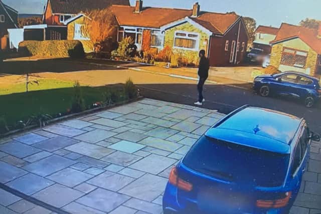 Police have released a CCTV image of a man posing as a courier who collected the cash from the pensioner