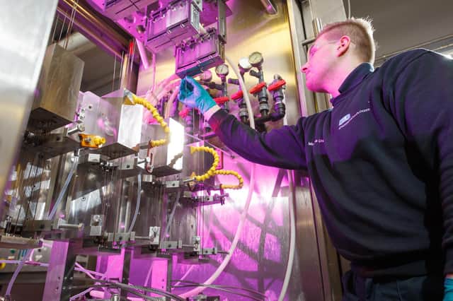 An ELE Advanced Technologies employee at work