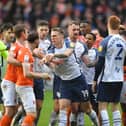Preston North End and Blackpool players have an exchanged of views in the derby clash at Bloomfield Road