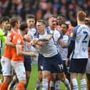 Preston North End and Blackpool players have an exchanged of views in the derby clash at Bloomfield Road